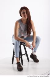 MOLLY SITTING POSE WITH GUN 2